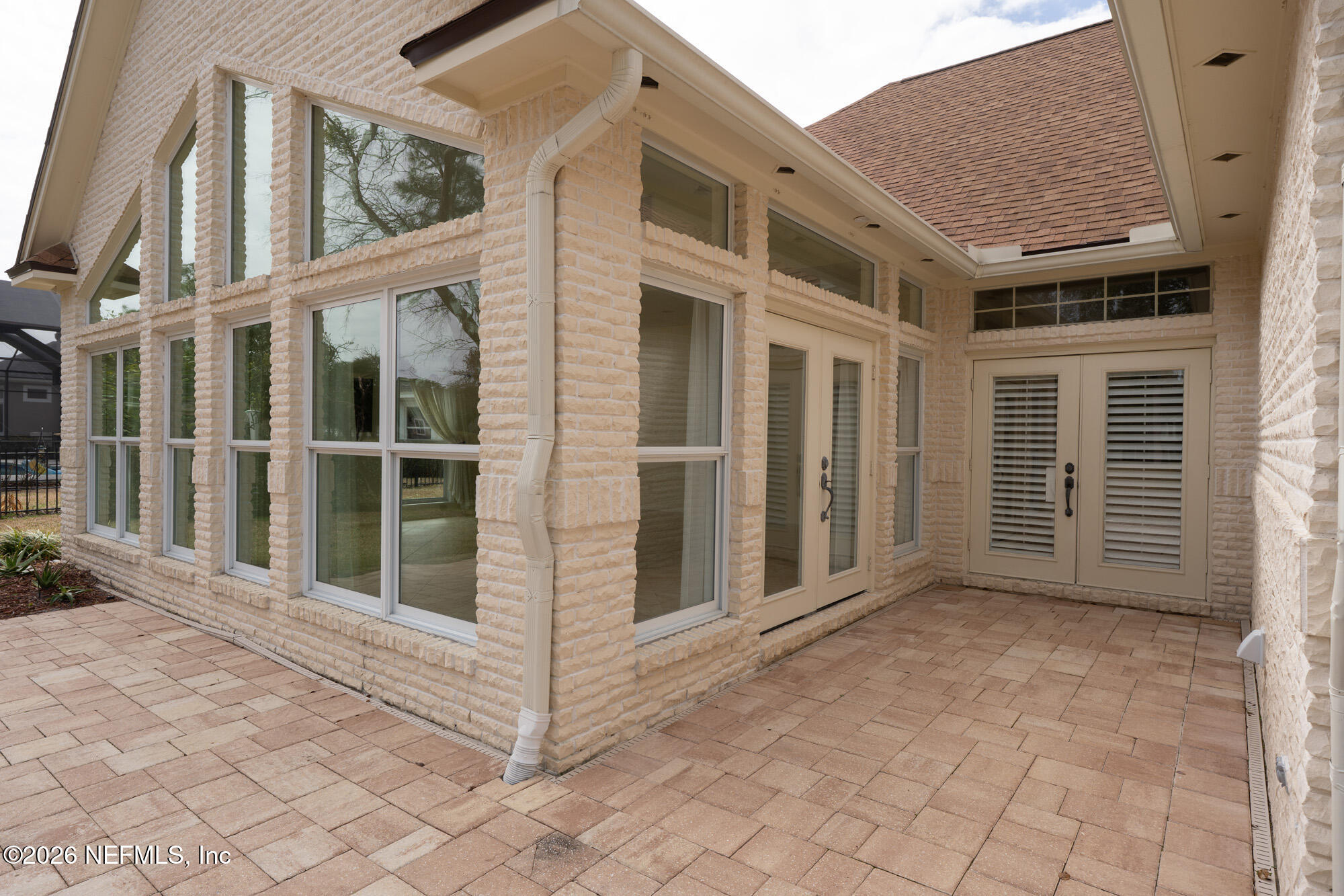 13177 Cricket Cove Road North Jacksonville, FL 32224 - Photo 35 of 39 a view of a brick house with a large window