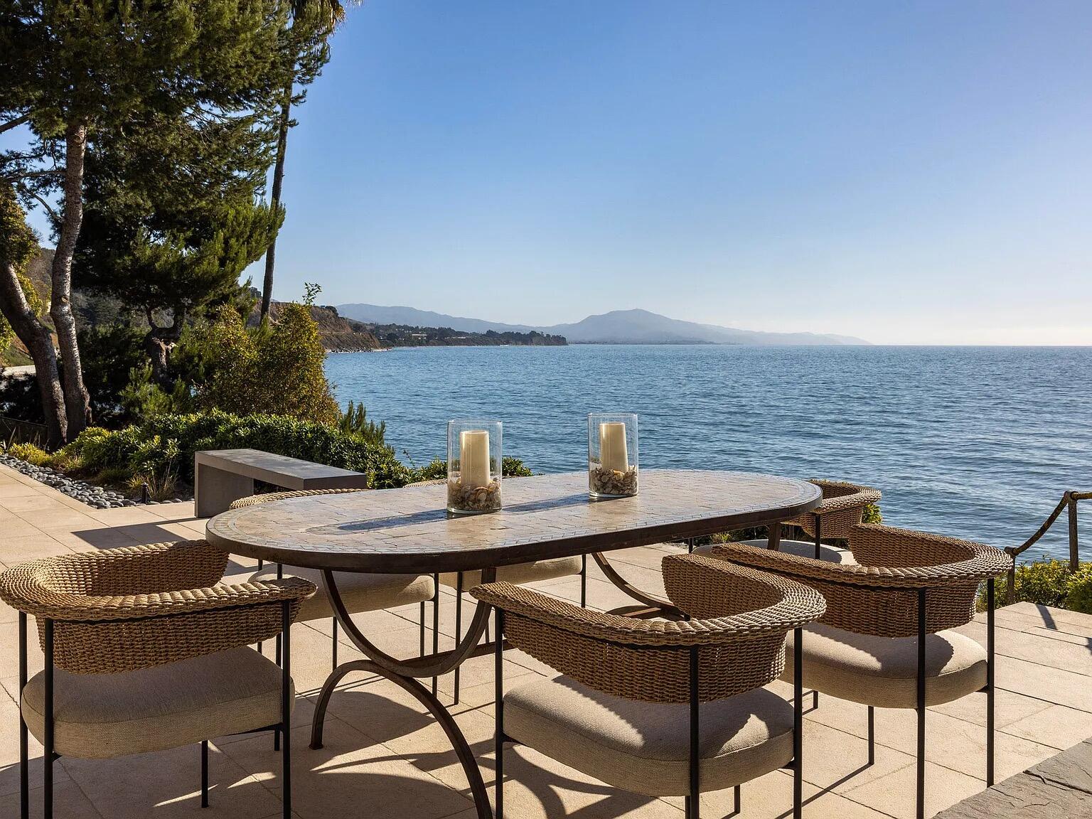 1803 Fernald Point Lane Santa Barbara, CA 93108 - Photo 11 of 16 a backyard of a house with table and chairs