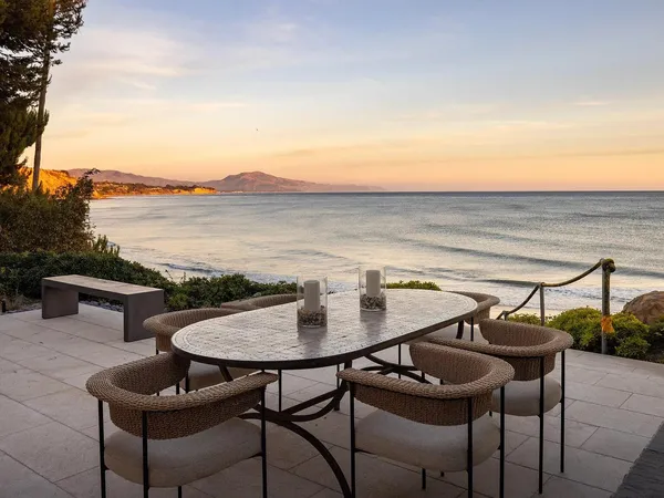 a terrace of a house with outdoor seating