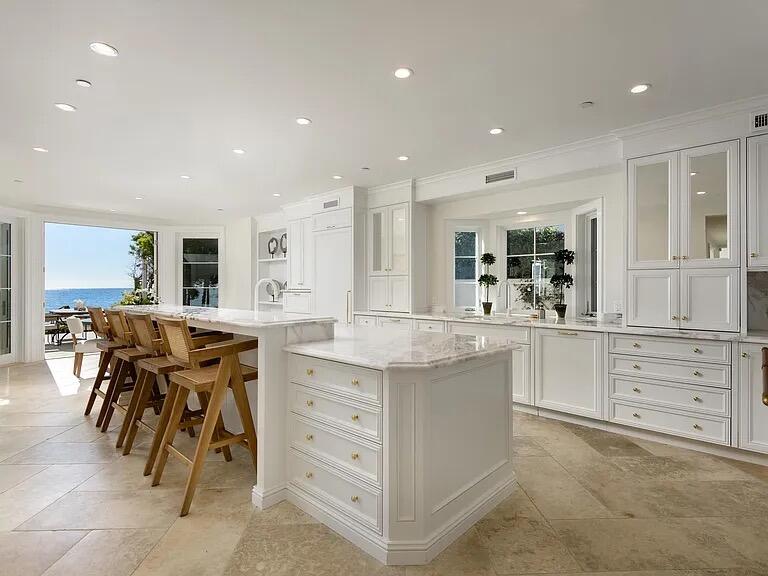 1803 Fernald Point Lane Santa Barbara, CA 93108 - Photo 8 of 16 a kitchen with kitchen island cabinets and chairs
