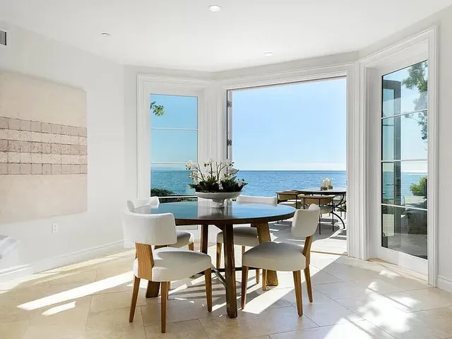 a view of a dining room with furniture window and outside view
