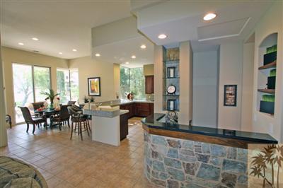 197 Loch Lomond Road Rancho Mirage, CA 92270 - Photo 8 of 25 a room with lots of tables a sink and a window