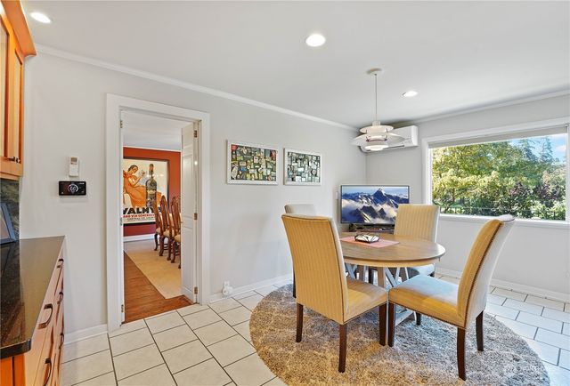 a view of a dining room with furniture window and outside view