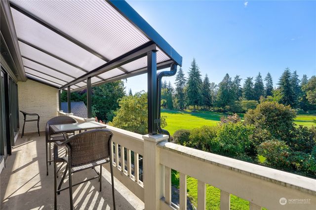 a view of a two chairs in the balcony