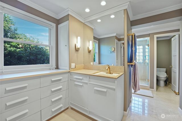 a view of a bathroom with a granite countertop sink mirror and a bathtub