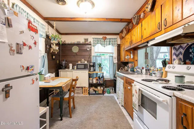 a kitchen with stainless steel appliances granite countertop a sink and cabinets