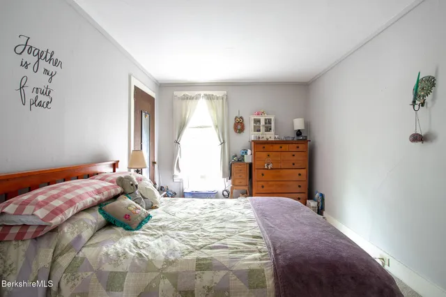 a bedroom with a bed and furniture