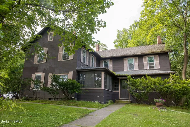 front view of a house with a yard