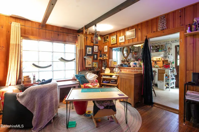 a outdoor dining space with furniture and wooden floor