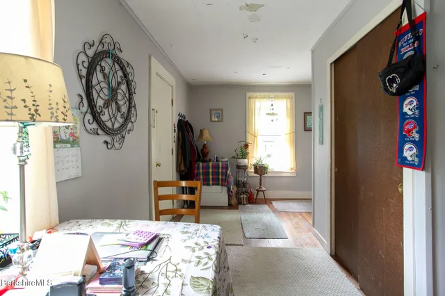 a bedroom with a bed and a chair