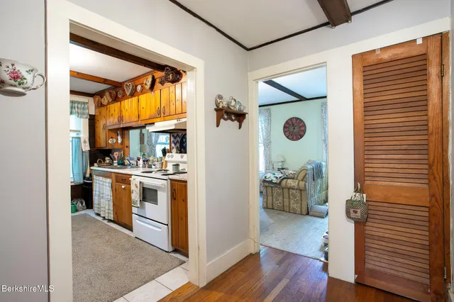a view of kitchen with furniture and wooden floor