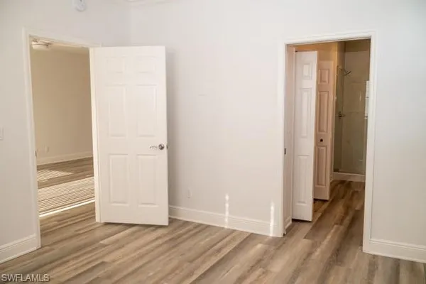 a spacious bathroom with 2 sink mirror and toilet