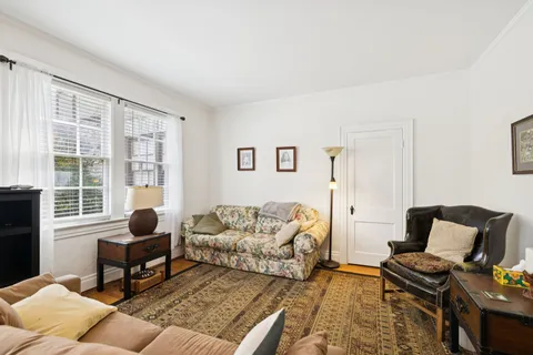 an aerial view of multiple houses with a street