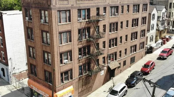 a view of a building and a yard
