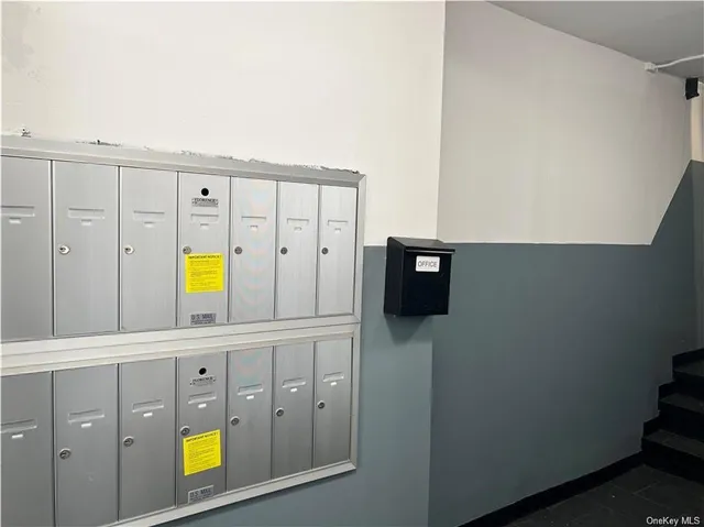a bathroom with a sink and two mirror