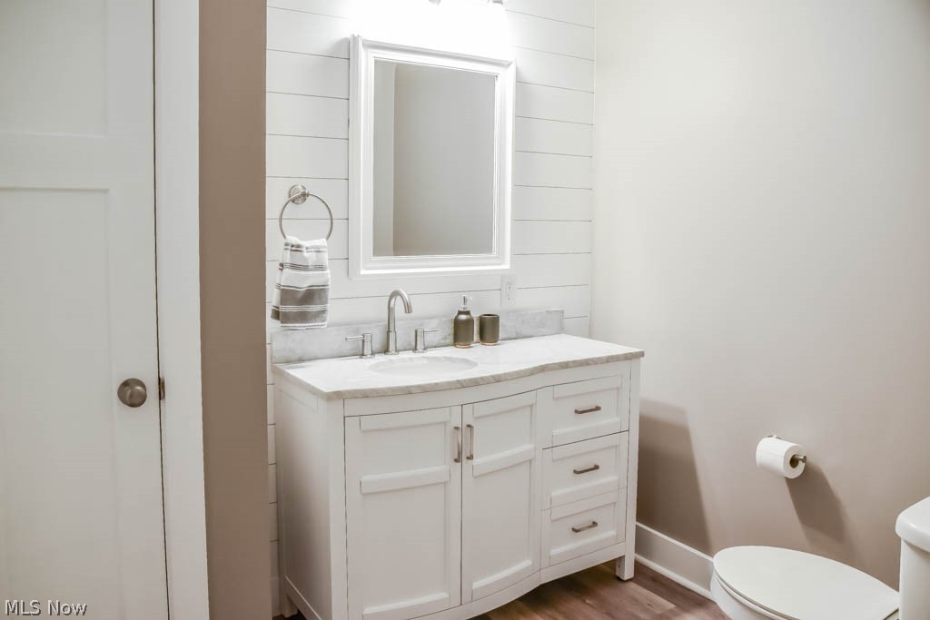 4394 Johnson Road Barberton, OH 44203 - Photo 18 of 25 Main full bath remodeled with a new vanity against a shiplap accent wall.