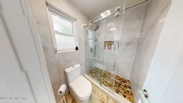 a bedroom with a large bed and a mirror