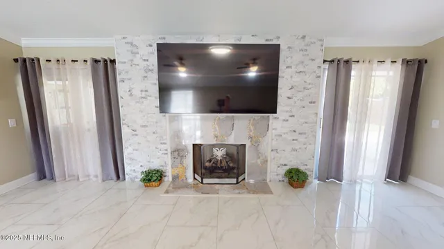 a kitchen with stainless steel appliances a refrigerator a sink a stove and white cabinets