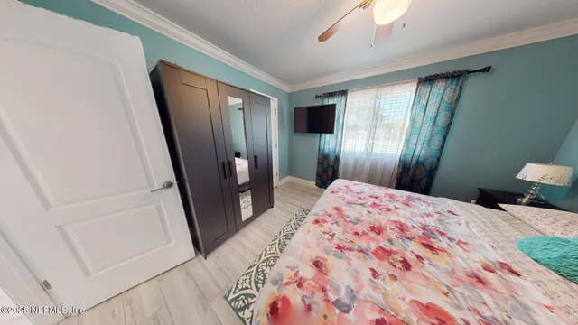 an empty room with chandelier fan