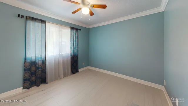 a balcony with furniture and garden view