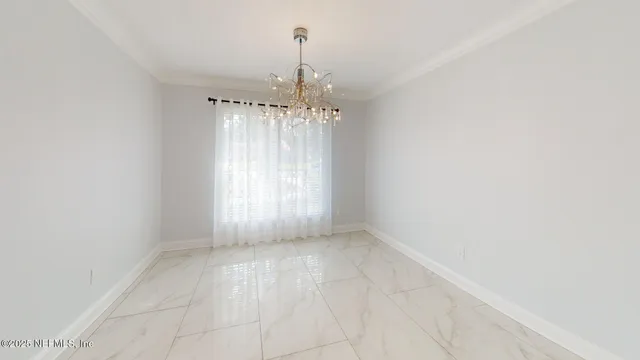 a view of a backyard with couches potted plants and wooden fence