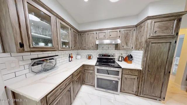 a view of living room with furniture and a flat screen tv