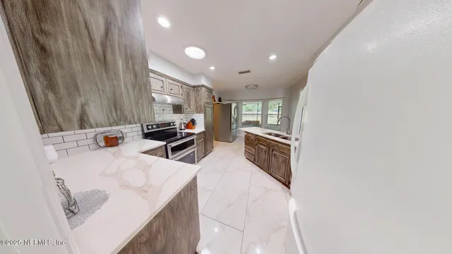 a room with furniture a washer and dryer