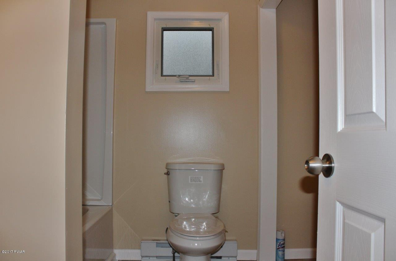 130 Stamford Road Dingmans Ferry, PA 18328 - Photo 16 of 25 a bathroom with a toilet