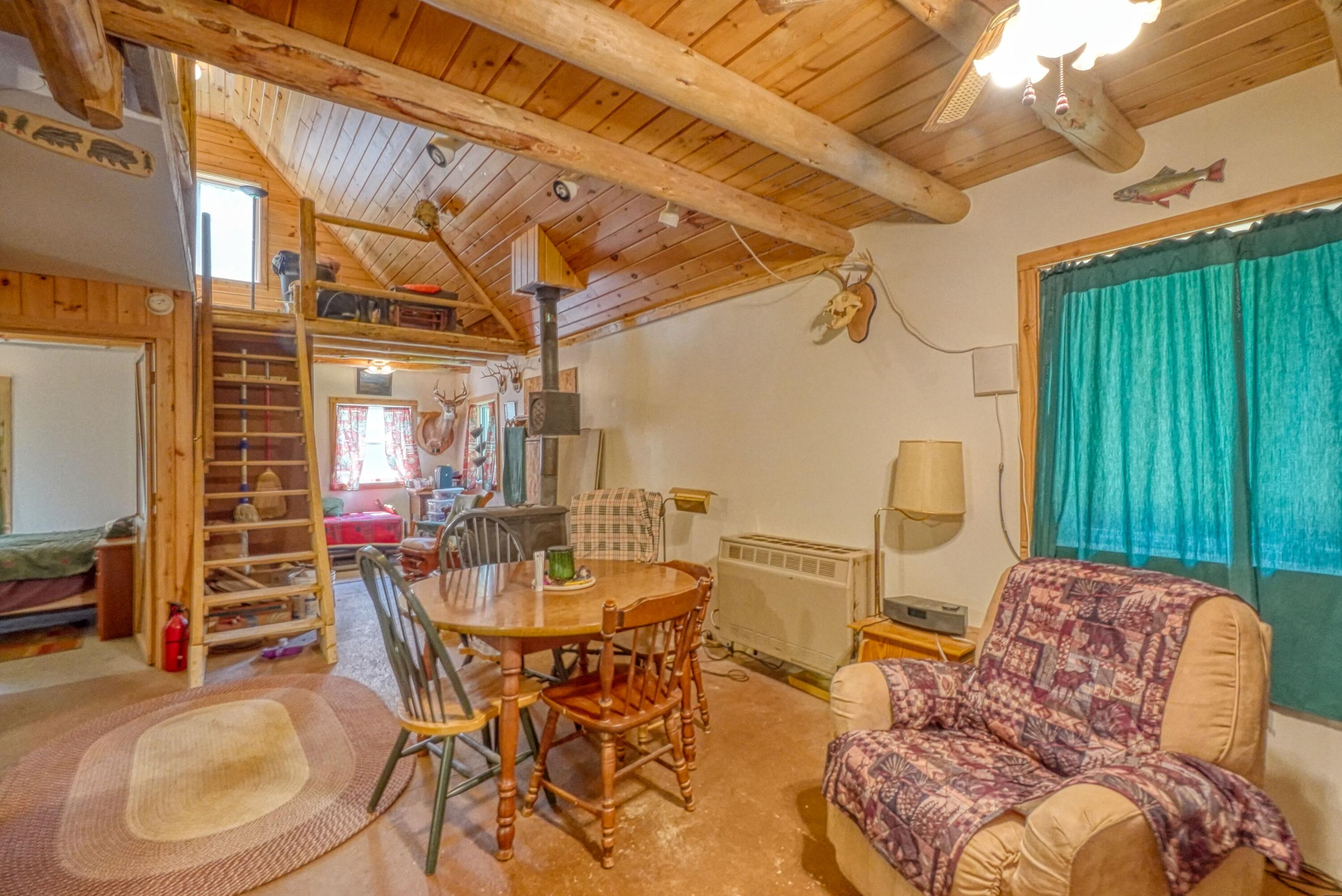 659 Sandy Beach Road Danforth, ME 04424 - Photo 9 of 27 Livingroom into Bedroom and Loft View
