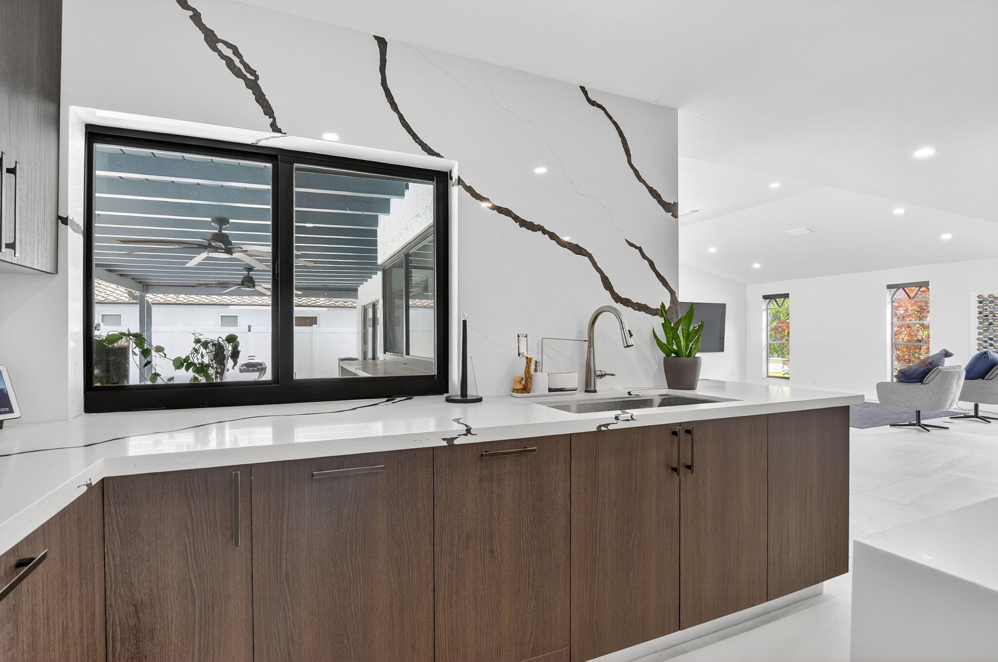 20833 Sonrisa Way Boca Raton, FL 33433 - Photo 17 of 50 a kitchen with a sink and a mirror