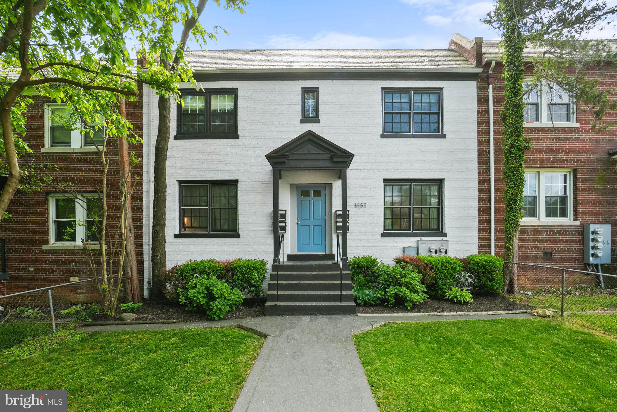 1653 Trinidad Avenue Northeast, Unit 2 Washington, DC 20002 - Photo 17 of 17 a front view of a house with garden