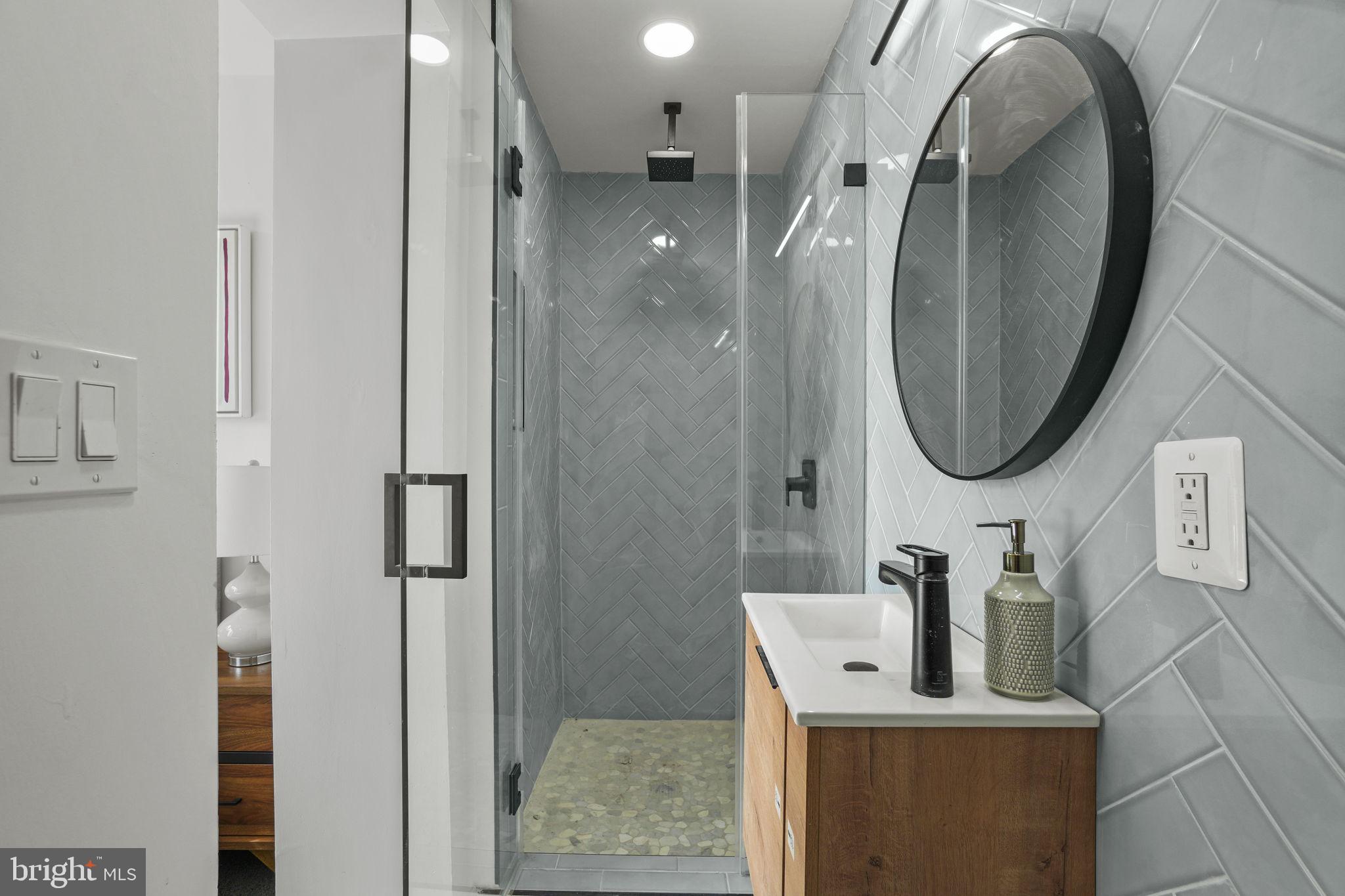 1653 Trinidad Avenue Northeast, Unit 2 Washington, DC 20002 - Photo 10 of 17 a bathroom with a sink and a mirror