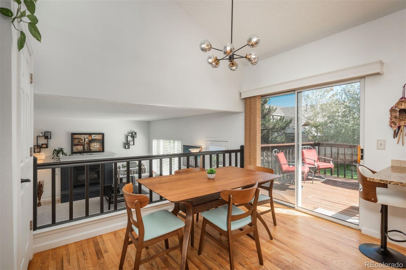 9222 Buttonhill Court Highlands Ranch, CO 80130 - Photo 13 of 44 a view of a dining room with furniture window and wooden floor