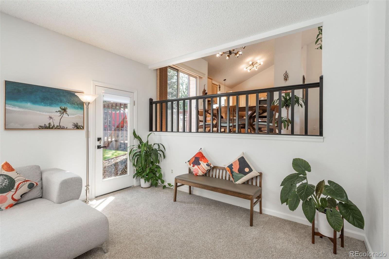 9222 Buttonhill Court Highlands Ranch, CO 80130 - Photo 19 of 44 a living room with furniture and a potted plant