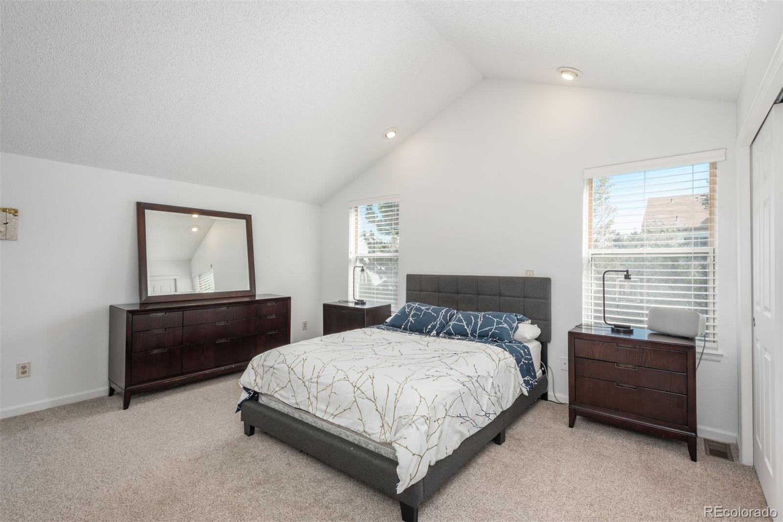 9222 Buttonhill Court Highlands Ranch, CO 80130 - Photo 24 of 44 a bedroom with a bed and window