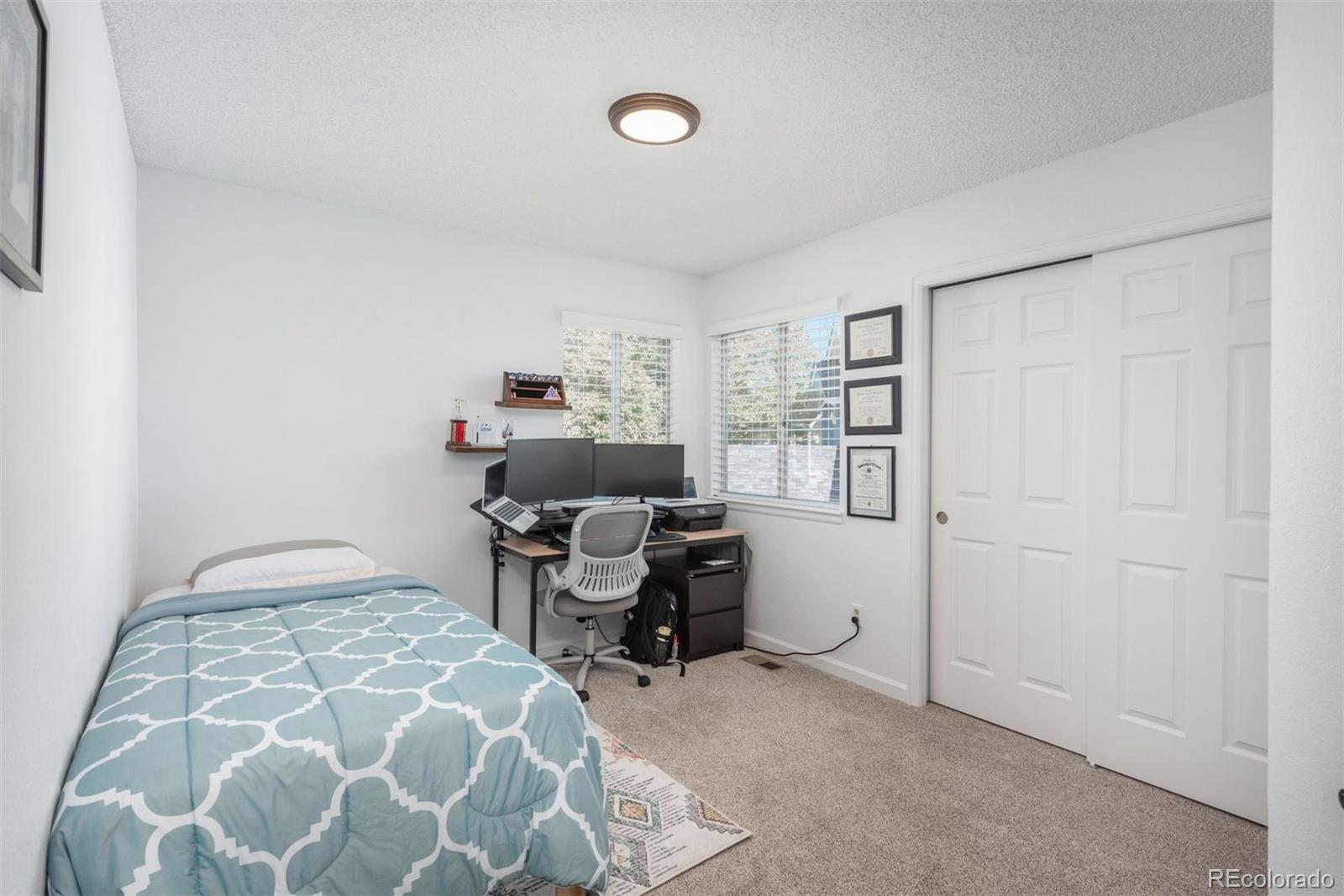 9222 Buttonhill Court Highlands Ranch, CO 80130 - Photo 31 of 44 a bedroom with a workspace