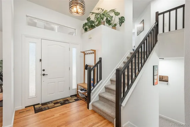 a view of an entryway with wooden floor