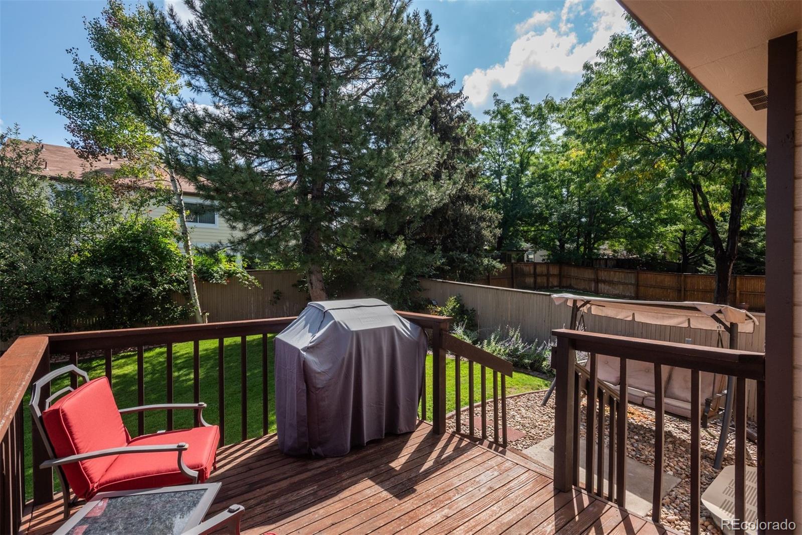 9222 Buttonhill Court Highlands Ranch, CO 80130 - Photo 41 of 44 a view of a deck with two chairs and a potted plant