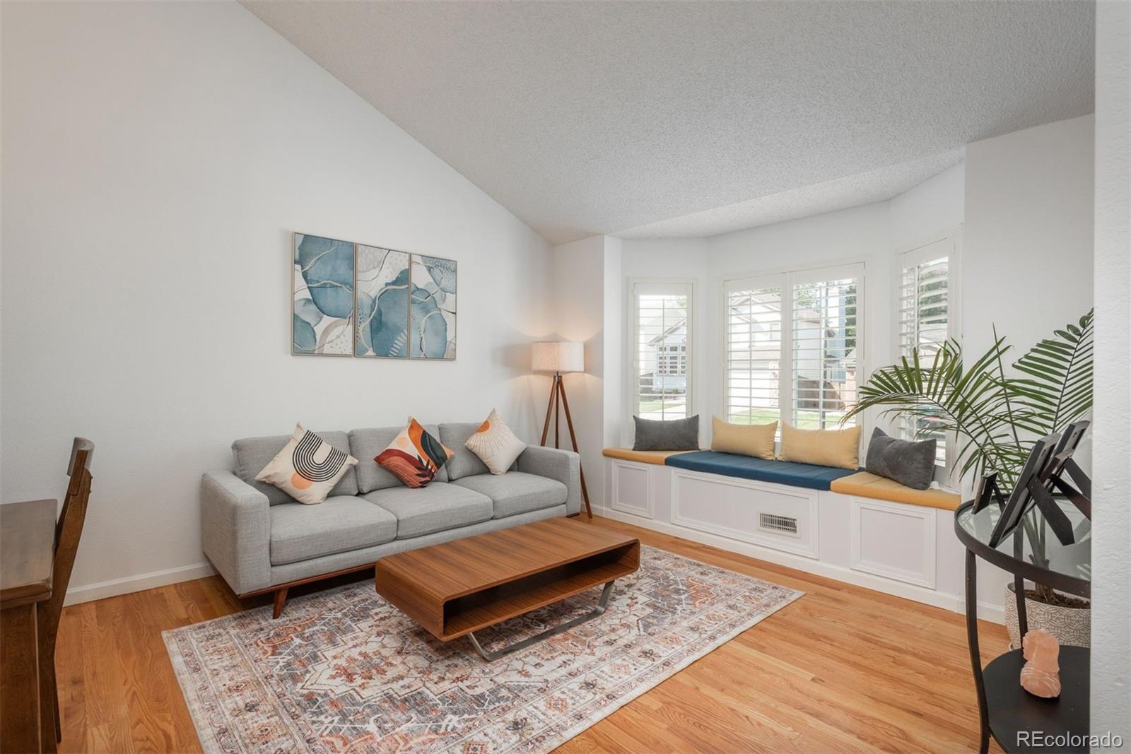 9222 Buttonhill Court Highlands Ranch, CO 80130 - Photo 5 of 44 a living room with furniture and a rug
