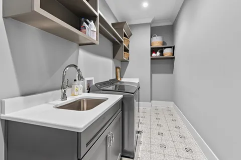 a kitchen with a sink and cabinets