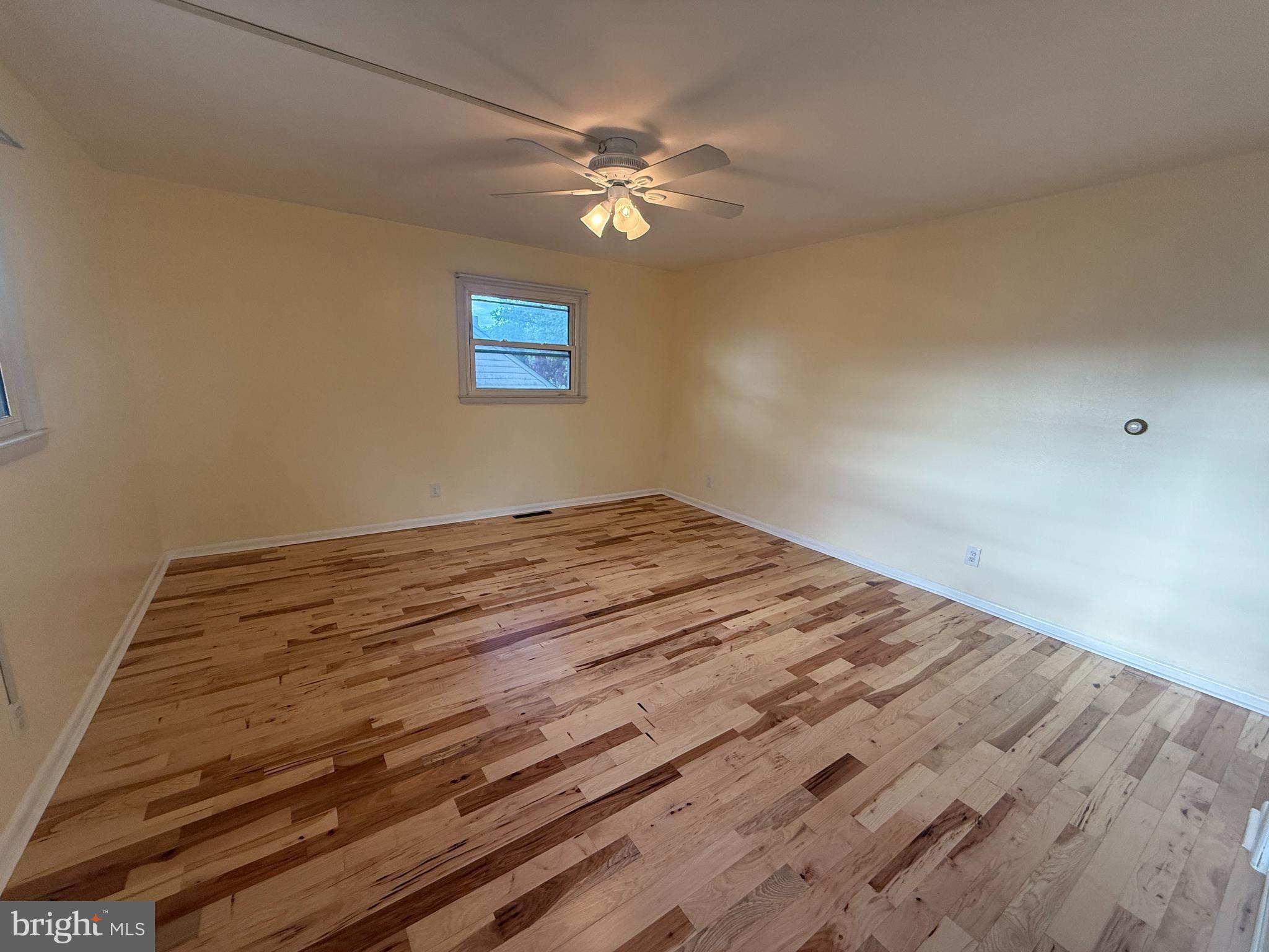 118 Spring House Road Cherry Hill, NJ 08002 - Photo 14 of 22 a view of wooden floor and a chandelier fan in a room
