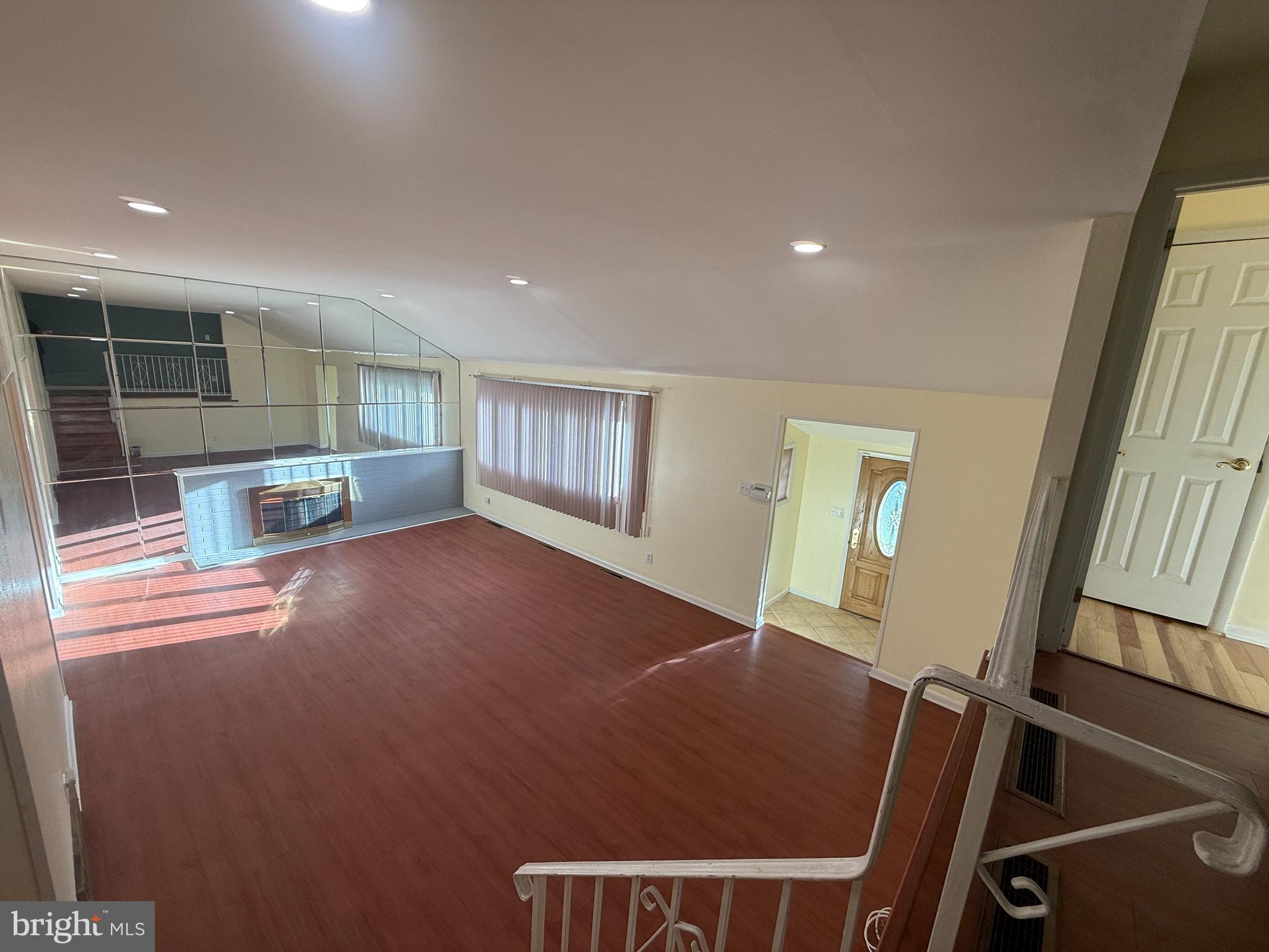 118 Spring House Road Cherry Hill, NJ 08002 - Photo 17 of 22 a view of an empty room with wooden floor and a window