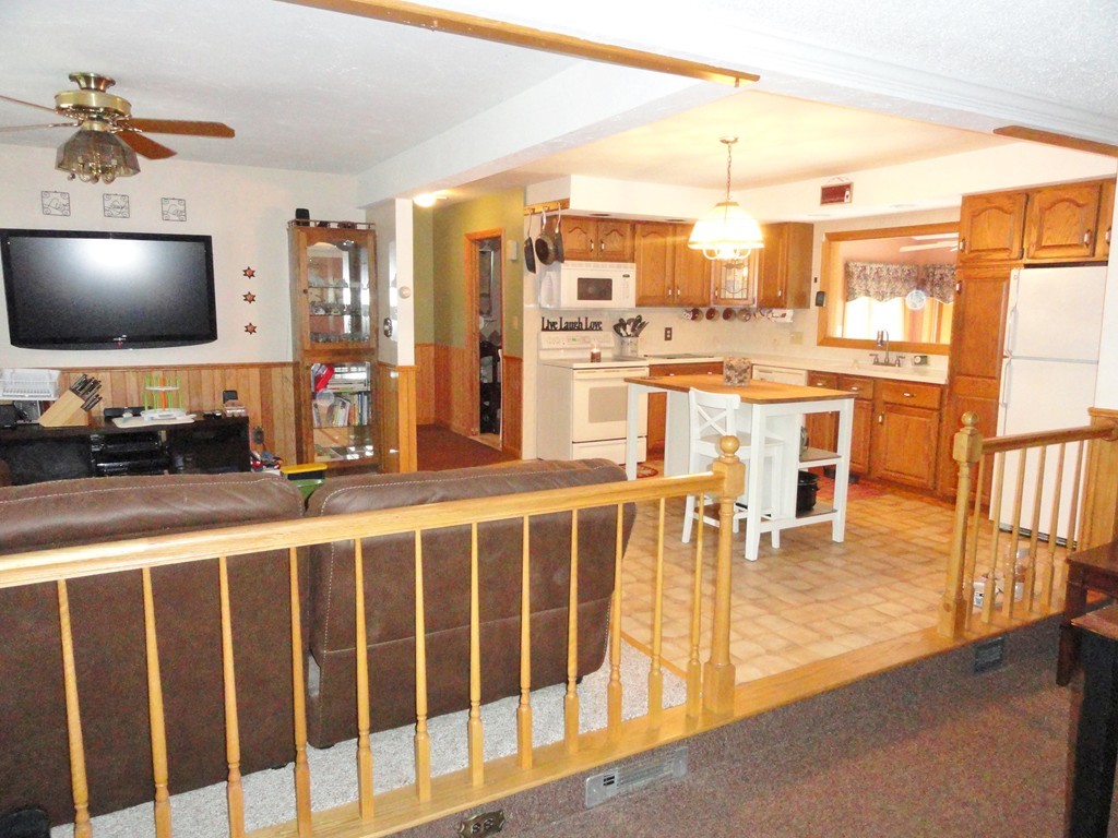 108 Knower Road Westminster, MA 01473 - Photo 14 of 25 a living room with large furniture and a flat screen tv