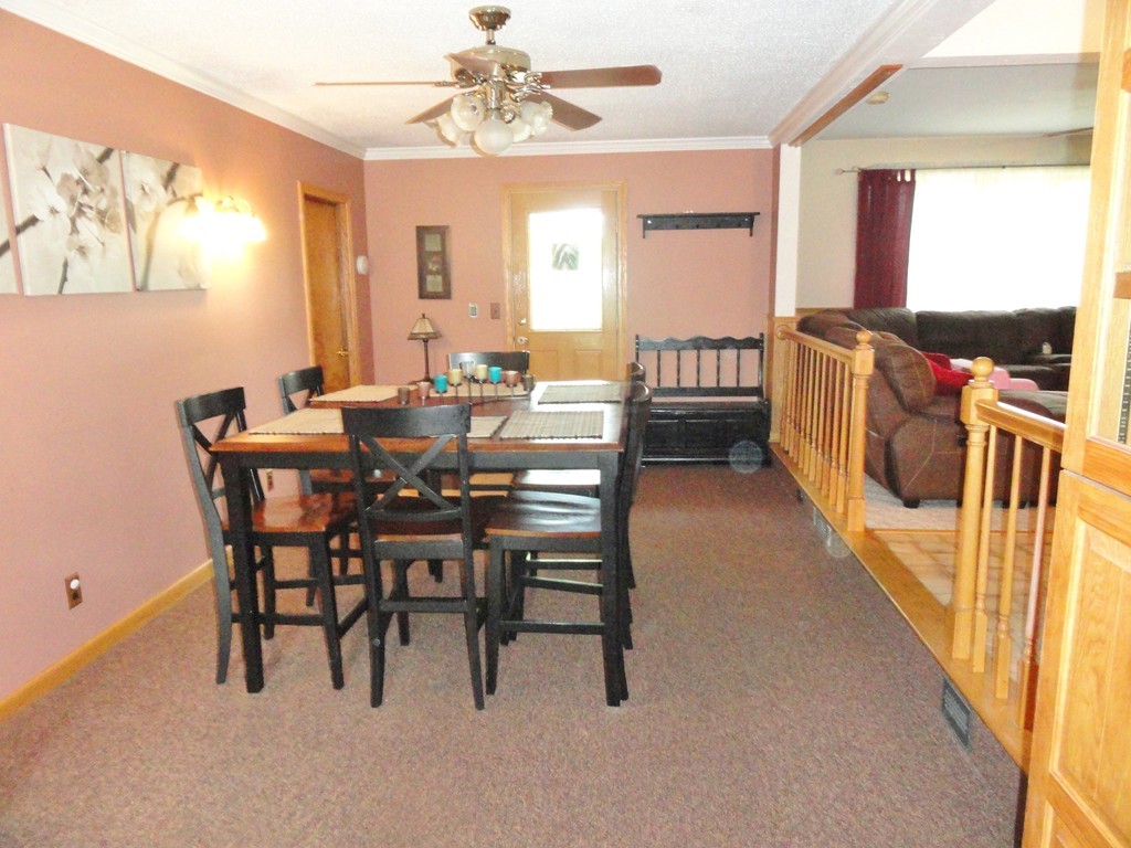 108 Knower Road Westminster, MA 01473 - Photo 16 of 25 a view of a dining room with furniture and a chandelier