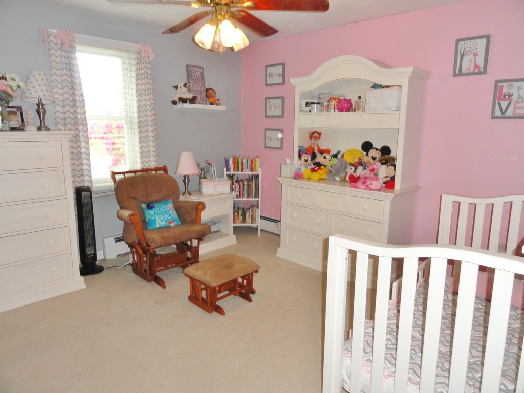 108 Knower Road Westminster, MA 01473 - Photo 20 of 25 a living room with furniture and a baby crib