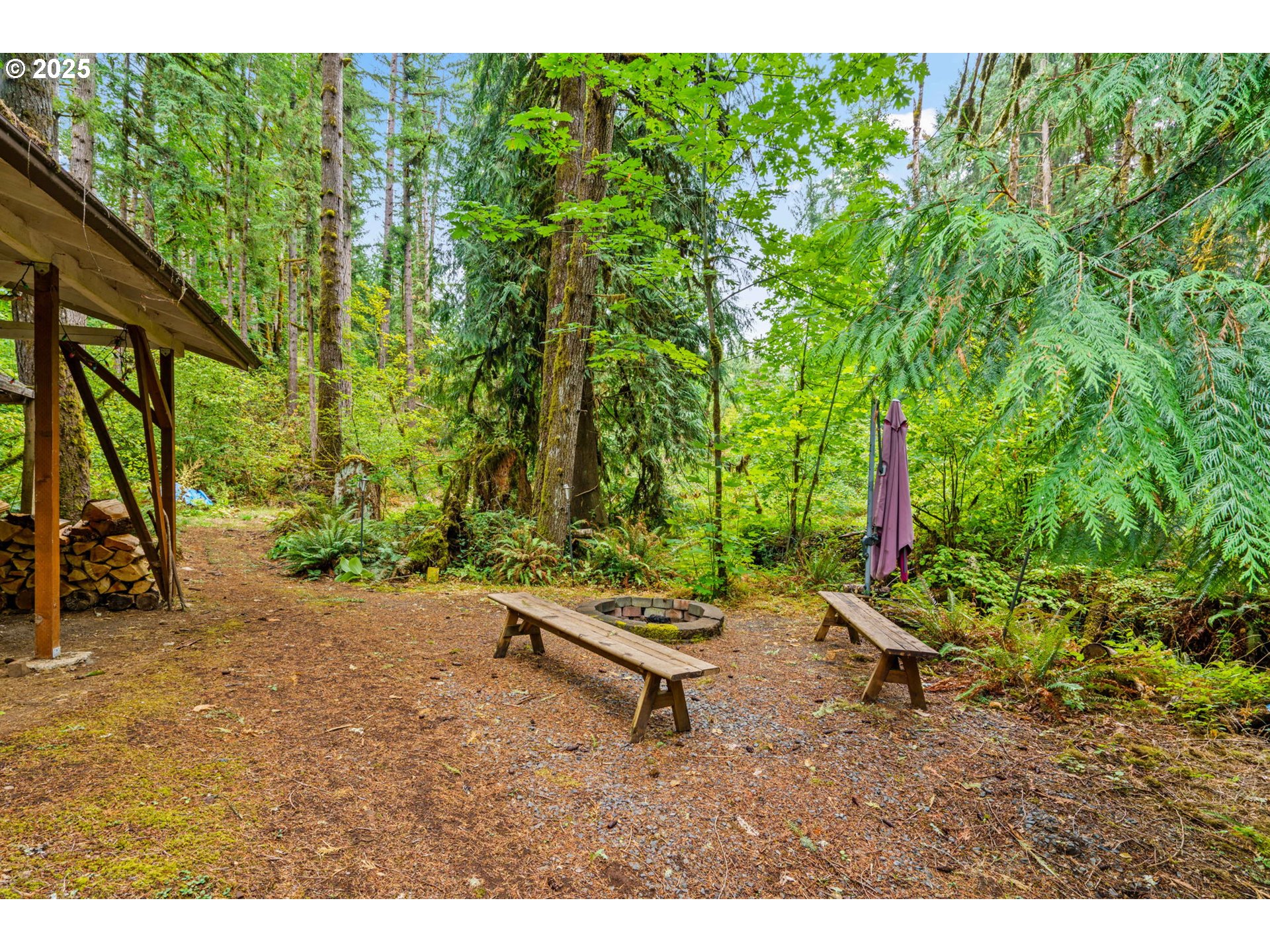 40153 Booth Kelly Road Springfield, OR 97478 - Photo 24 of 44 a backyard of a house with table and chairs