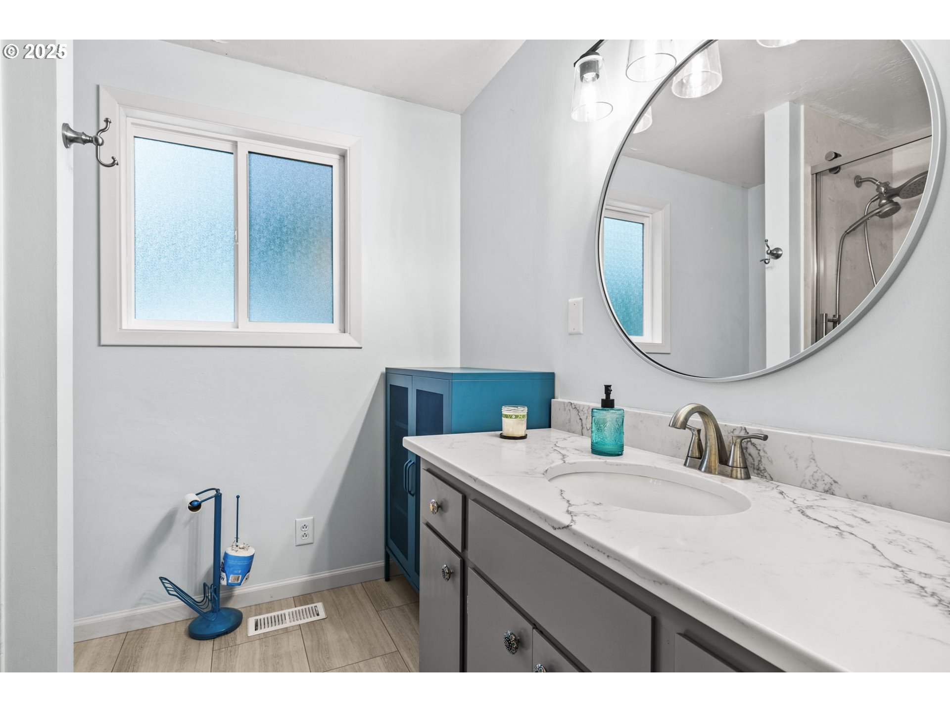 40153 Booth Kelly Road Springfield, OR 97478 - Photo 30 of 44 a bathroom with a sink vanity and a mirror