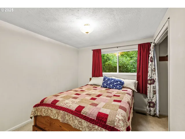 a utility room with closet dryer and washer