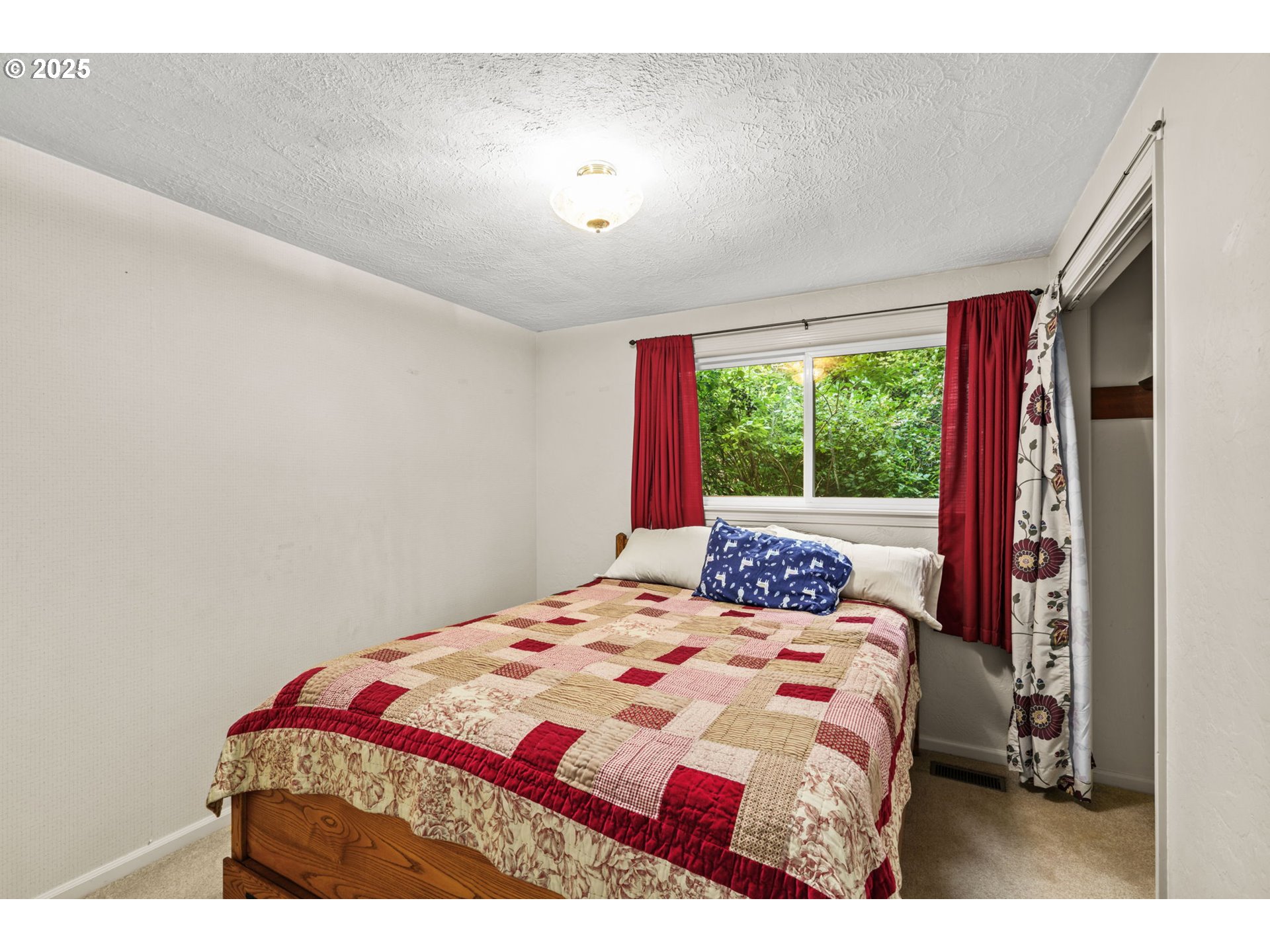 40153 Booth Kelly Road Springfield, OR 97478 - Photo 37 of 44 a bedroom with a bed and a large window