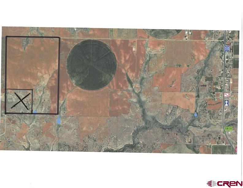 11260 Rd R Cahone, CO 81320 - Photo 19 of 26 a aerial view of a house with a yard and sitting area